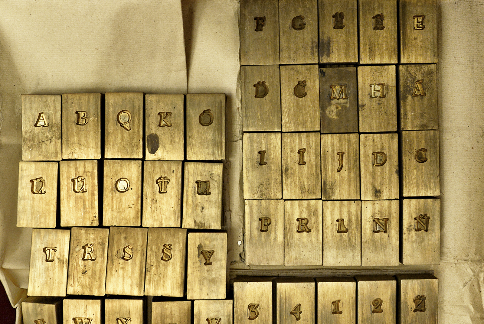 Brass matrices from the Archive of the Chamber of Deputies are probably the only preserved specimens of Menhart’s Parlament typeface. In addition to the matrices, the documentation of the production and handover of the typeface is stored in the archive.